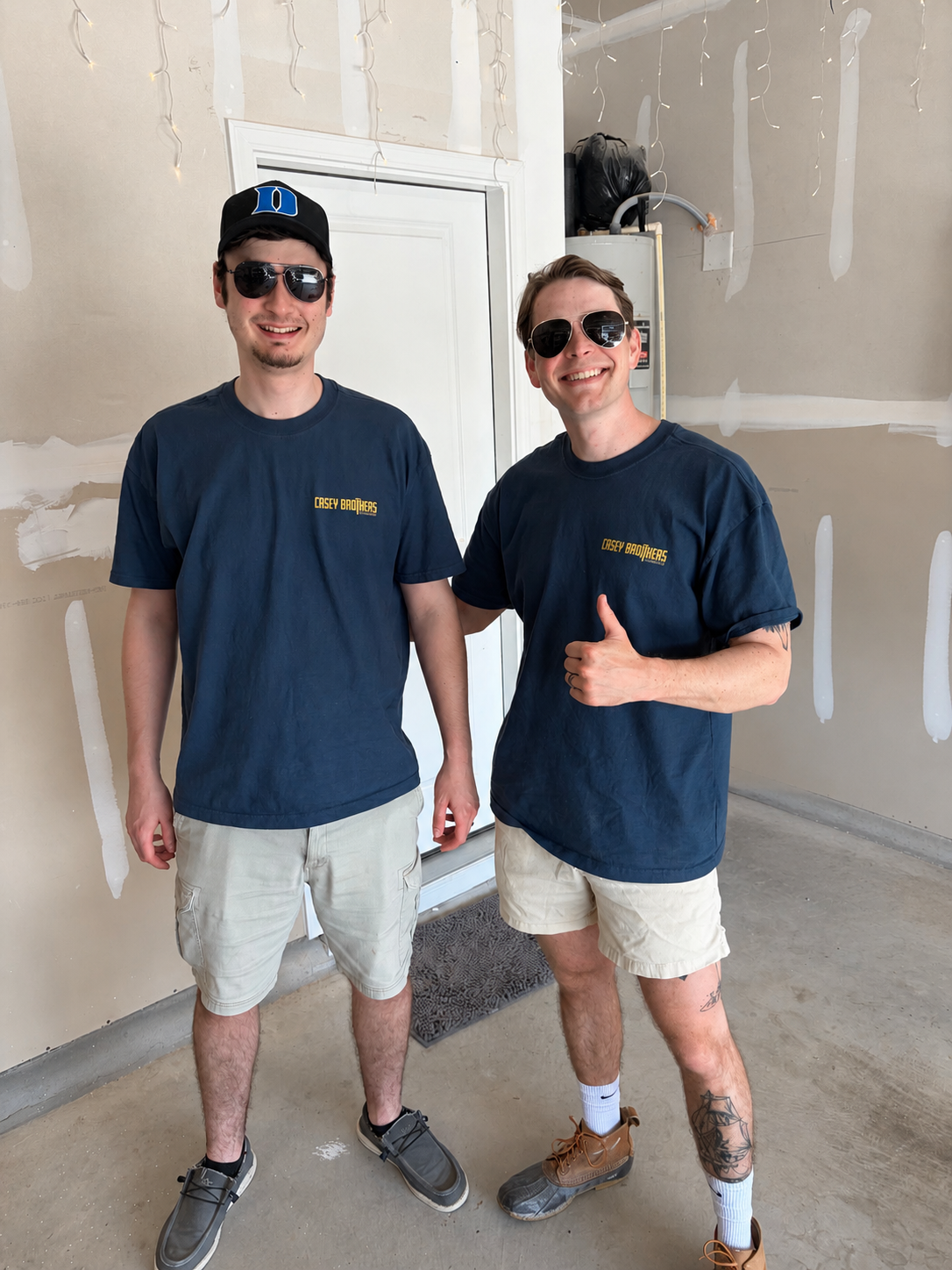 Zack and Logan Casey on a job site